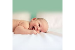 Infant baby happy laying down
